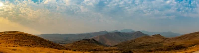 View from Silver City Road, Idaho Panoramic color photograph of rolling desert hills and distant mountains viewed from Silver City Road in Idaho.